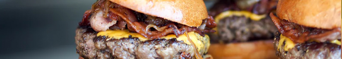 Eating Burger Food Stand at Hat Creek Burger Company restaurant in Austin, TX.